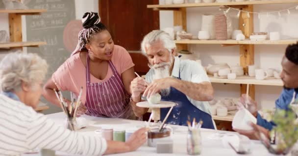 Happy Diverse Group Potters Glazing Clay Jugs Discussing Pottery Studio — Stock Video