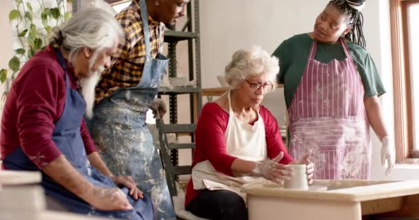 Happy Biracial Female Potter Others Using Potter Wheel Pottery Studio — Stock Video