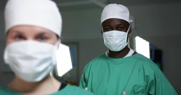 Portrait Diverse Surgeons Wearing Surgical Gowns Operating Theatre Slow Motion — Stock Video