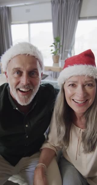 Vertical Video Happy Senior Caucasian Couple Wearing Santa Hats Having — Stock Video