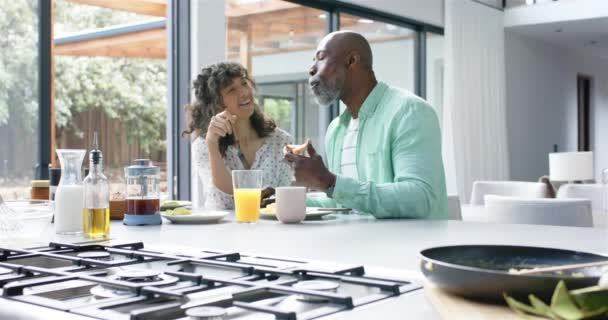 Happy Biracial Couple Having Breakfast Talking Kitchen Slow Motion Domestic — Stock Video