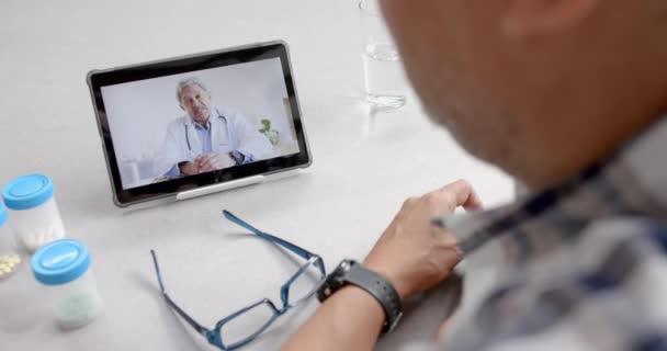 Senior Biracial Male Doctor Patient Home Having Video Call Tablet — Stock Video