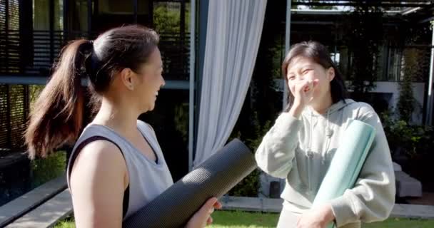 Happy Asian Female Friends Exercise Mats Laughing Sunny Terrace Slow — Stock Video