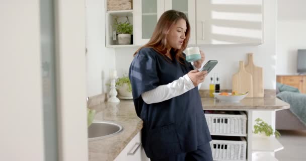 Happy Size Biracial Female Doctor Coffee Using Smartphone Home Copy — Stock Video