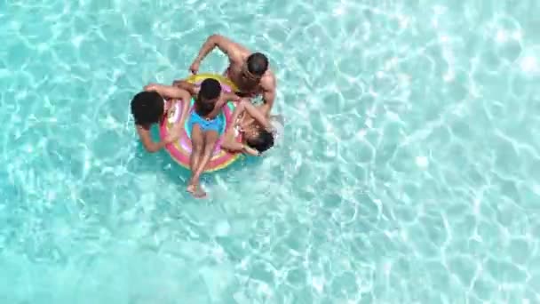 Aerial African American Parents Son Daughter Playing Inflatable Sunny Pool — Stock Video