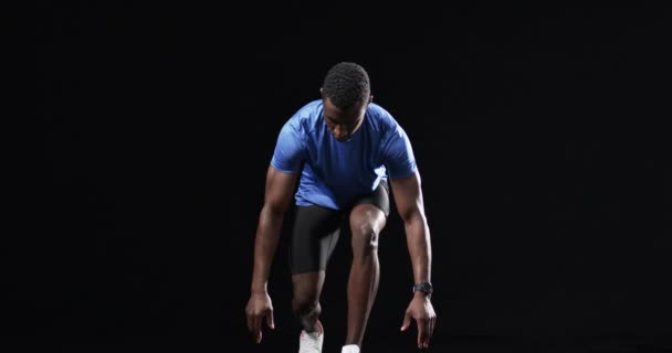 African American Man Starting Position Sprint Black Background Captured Studio — Stock Video