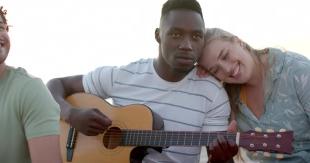 Young African American Man Plays Guitar Outdoors Beach Party Young — Stock Video