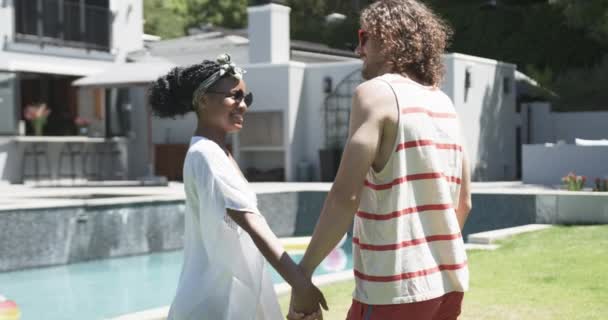 Diverse Couple Enjoys Sunny Day Pool Home Share Joyful Moment — Stock Video