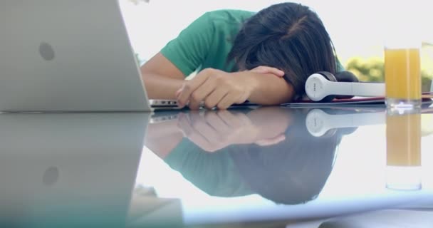 Teenage Asian Boy Rests His Head Desk Home While Studying — Stock Video