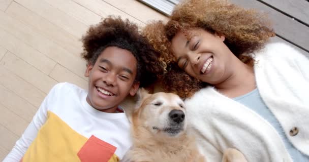 Portrait Happy African American Mother Son Lying Floor Pet Dog — Stock Video