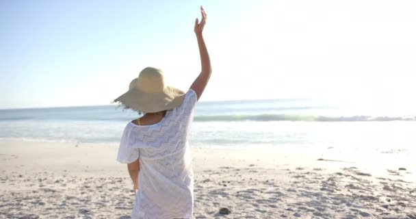 Young Biracial Woman Enjoys Beach Copy Space Arms Outstretched Sea — Stock Video