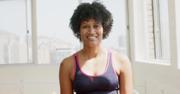 Young Biracial Woman Exercises Reformer Pilates Machine Gym Fitness Routine — Stock Video