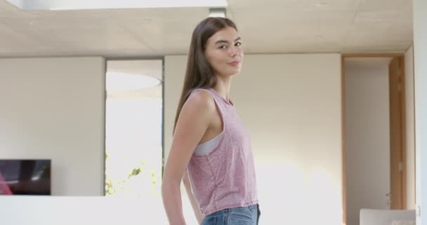 Teenage Caucasian Girl Long Brown Hair Smiles Modern Home Setting — Stock Video