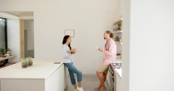Diverse Couple Enjoys Conversation Modern Kitchen Home Asian Girlfriend Caucasian — Stock Video