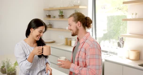 Diverse Couple Enjoys Warm Drink Kitchen Home Asian Girlfriend Caucasian — Stock Video