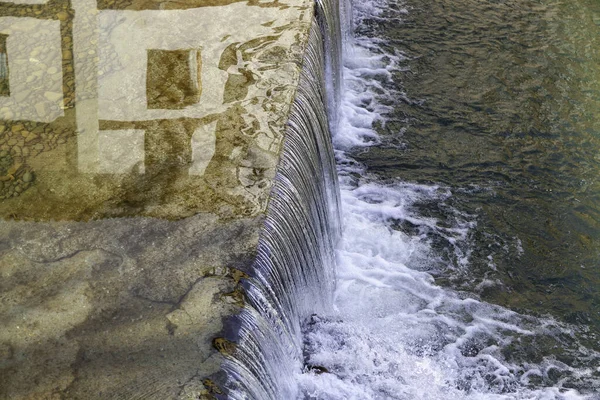 Detail of flow of a river in nature, conservation of the environment