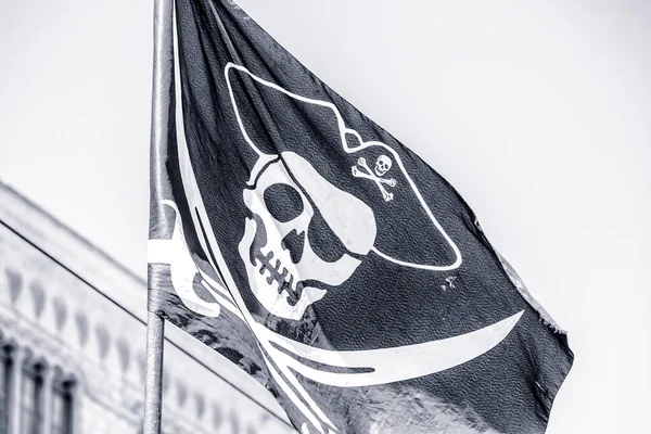 Detail of old pirate flag, looting danger and crime