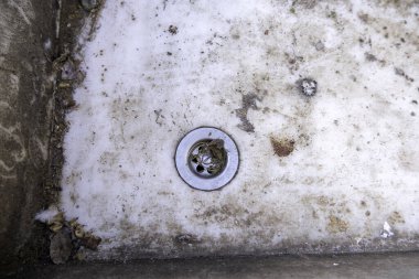 Detail of old broken ceramic sink in the garbage
