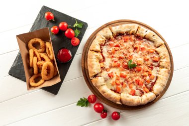 Indian pizza on a white background with snacks. Indian fast food set.