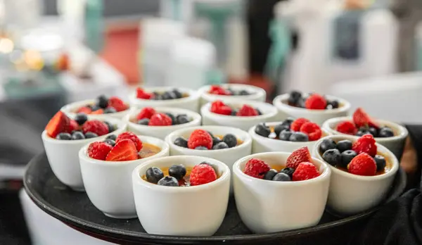 nicely decorated fresh berries dessert served for an event, catering service, celebration meal time. High quality photo