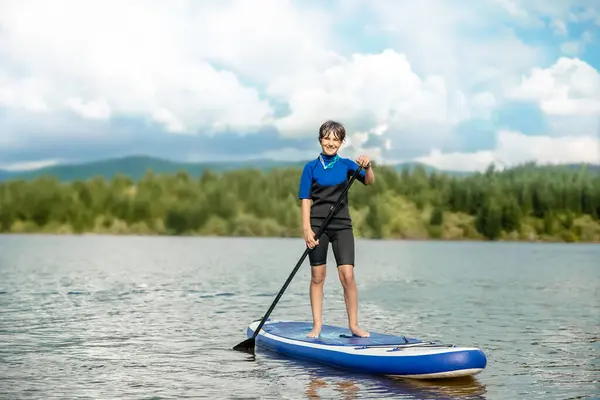 Active Teen Girl Paddling Sup Board River Lake Natural Background Stockfoto