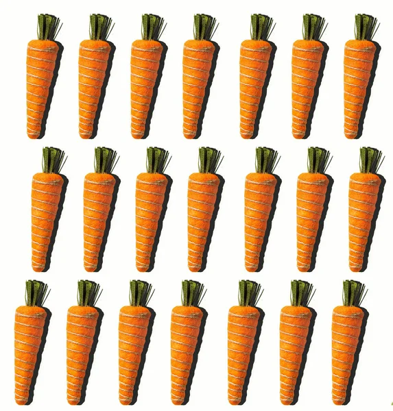 Karottenmuster Vor Weißem Hintergrund Osterfeier Gesundes Essen Hochwertiges Foto lizenzfreie Stockbilder