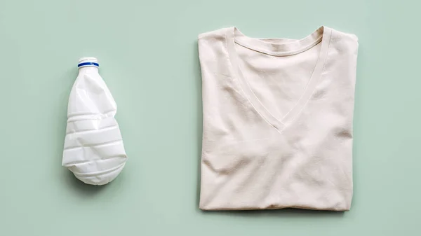 Recycle clothes concept. Recycling Fibers in the Textile Industry. Sustainable recycled cotton fiber. Recycled cloth T-shirt and plastic bottle.