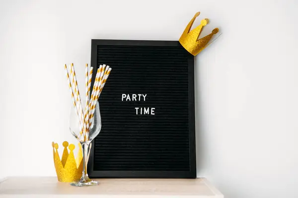 Party time fun celebration event minimal concept with blackboard with text Party time on white. Party supplies, banners, balloons and event rentals for birthdays, graduation parties, anniversaries.