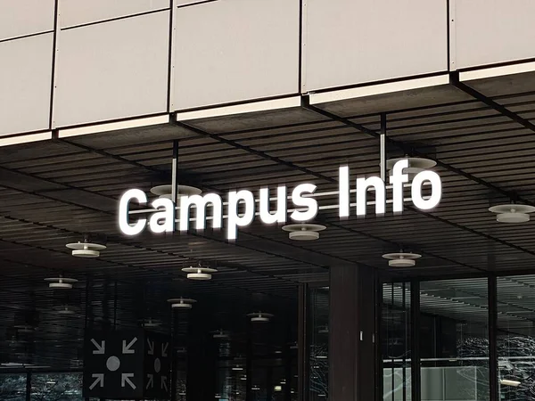 Campus Info banner or sign on a European university campus, no people.