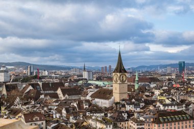 24-12-2024 Zurich, Switzerland. Winter aerial view taken from Grossmunster Cathedral tower. Old city center with church towers clipart