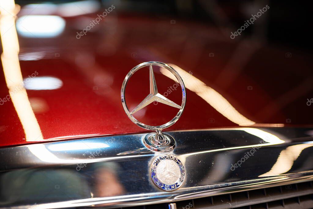 Classic Mercedes Benz star emblem hood ornament. Close up detail shot, shallow depth of field, no people