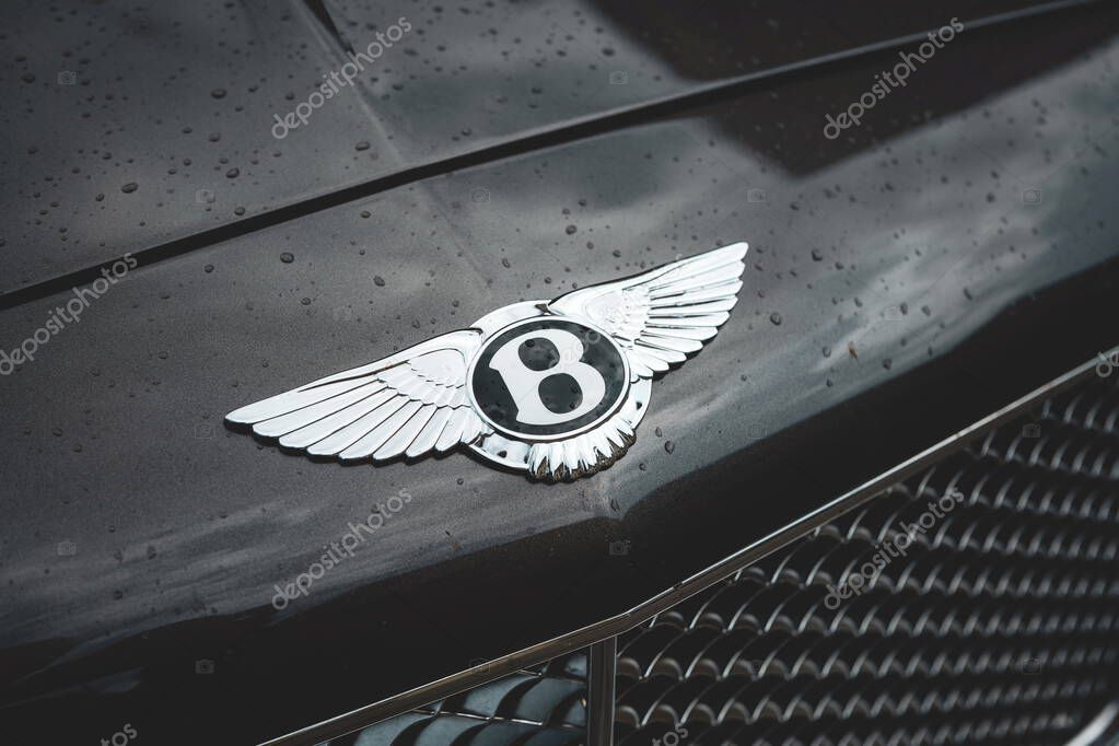 08-06-2025, Kempttal, Switzerland. Bentley hood or bonnet ornament emblem or badge. Top down, close up detail shot, no people