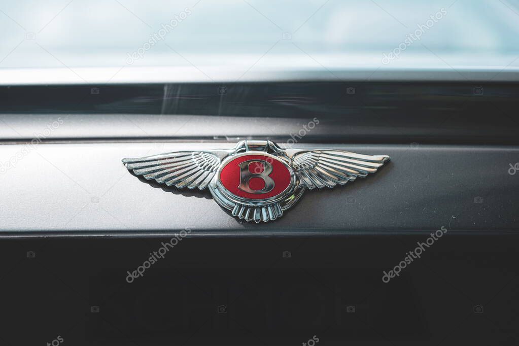 08-06-2025, Kempttal, Switzerland. Bentley hood or bonnet ornament emblem or badge. Top down, close up detail shot, no people