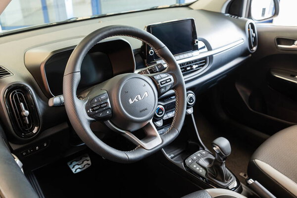 Safenwil, Switzerland, August 16, 2025. New KIA Ceed compact segment family car interior view. Emil Frey open days showroom floor, wide angle view, window light