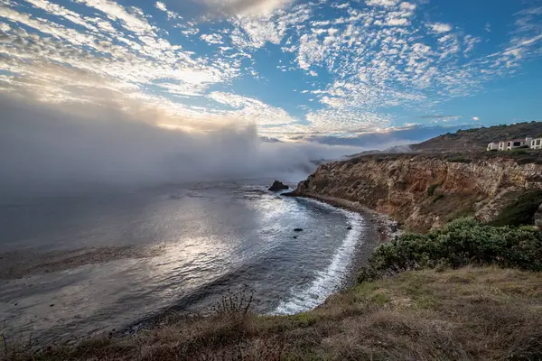 stock image Experience the beauty of Rancho Palos Verdes as a marine layer blankets the coast, creating a mesmerizing cloudscape over rugged cliffs and hidden gems like Point Vicente Lighthouse and Pelican Cove.
