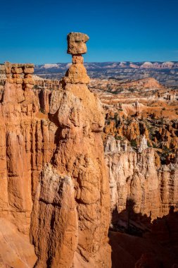 Thor's Hammer towers against the blue sky, highlighting Bryce Canyon's unique formations. clipart