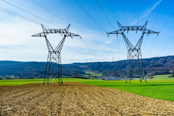Electricity Transmission Pylons Power Linee Voltage Towers Spring Agricultural Landscape — Stock Photo, Image