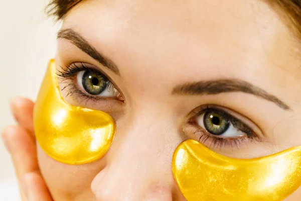 Woman Applying Golden Collagen Patches Eyes Mask Removing Wrinkles Dark — Stock Photo, Image