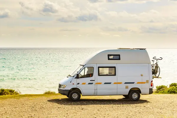 Campervan rv camping on sea shore in Spain. Van life, motor home holidays.