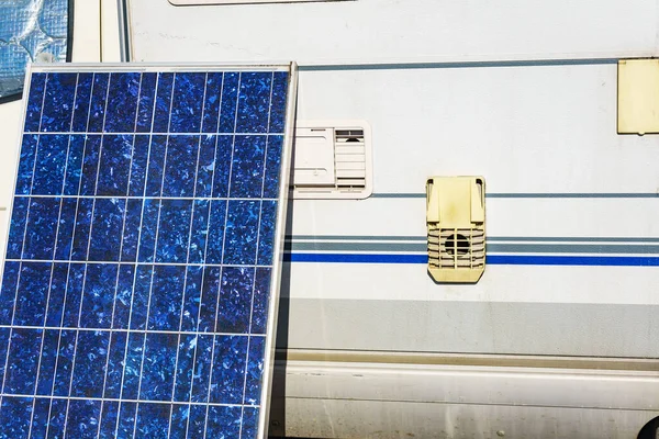 Solar photovoltaic panel, charging battery at camper car rv. Electricity in motorhome trip. Camping equipment