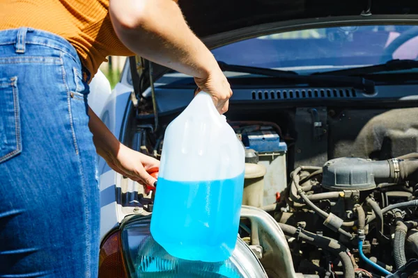 Woman Pouring Blue Antifreeze Liquid Auto Windshield Screen Washing Bottle — Stock Photo, Image