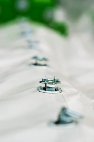 Close up of white party event tent details, hooks, , cord. Detailed objects concept.