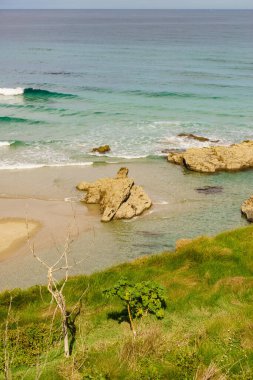 Cantabric coast landscape in northern Spain. Cliff formations on Cathedral Beach, Galicia Spain. Playa de las Catedrales, As Catedrais in Ribadeo, province of Lugo. Tourist attraction. clipart