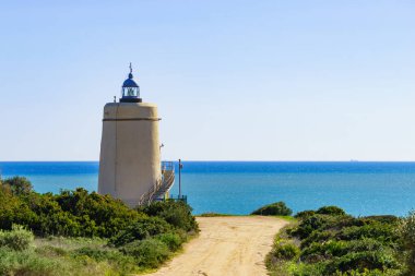 Carbonera Lighthouse located on Punta Mala, La Alcaidesa, Spain. Lantern overlooks the Strait of Gibraltar. clipart
