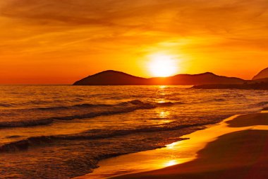 Sunset over sea. Seaside landscape. Calblanque Beach, Murcia Spain. clipart