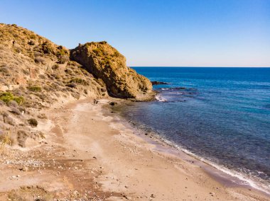 Aerial view of spanish coast, Sombrerico Beach, Mojacar in Almeria Spain. Travel and enjoying the Mediterranean sea. Seaside landscape. clipart