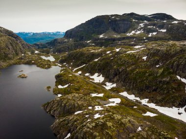 Aerial view. Norway landscape. Road and lakes in stony rocks mountains. Norwegian national tourist scenic route Ryfylke. clipart