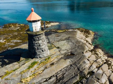 Seascape on Lofoten islands with Gimsoysand lighthouse, Gimsoya island, Nordland county Norway. clipart