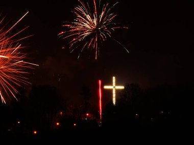 Firework explosion in the sky, celebrating new year in Gdynia city, Poland. Colorful fireworks at holiday night. clipart