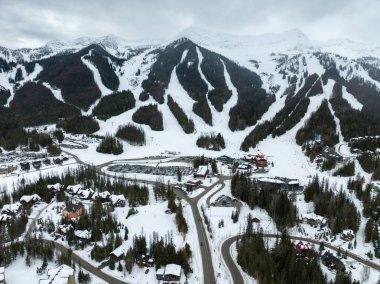 Fernie British Columbia Canada Alpine Ski Resort Mountain Slopes During Winter Day clipart